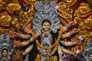 Beautifully ornamented statue of Goddess Durga with vibrant colors and detailed craftsmanship in Bhubaneswar, India.